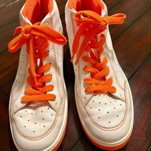 CHANEL MEN'S SIZE 12 HIGH TOP WHITE LEATHER SNEAKER WITH ORANGE SOLE AND TRIM